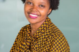 woman in gray and yellow pussybow top