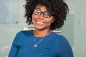 smiling woman sitting on black chair