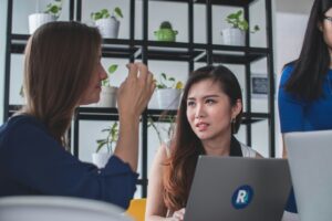 woman sitting in front of laptop